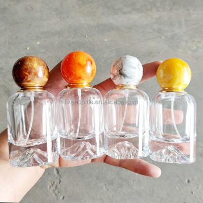 China Crimp neck New design hill shape bottom 50ml luxury empty glass perfume bottle for sale