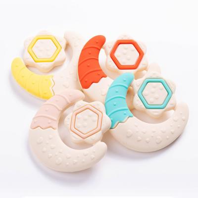 China Custom Baby Teething Toys Star Moon Shape Hand Grasp Silicone Grip Teether for Infants for sale