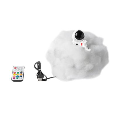 China Hotel Creative Gifts for Kids Resin Astronaut Ornaments White Cloud Light Night Light USB Remote Control Bedside Light for sale