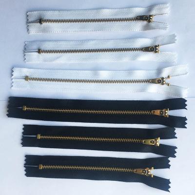 China Multi Size Reversible Black Multi Size Reversible Auto Coil Lock Open End Brass Plastic Puller White Gold Brass Puller for sale