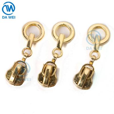 China DAWEI Brand Shining Gold Auto-Lock Woven Nickel Free Zipper Pullers Class 4 Sliders Metal Zipper Puller Head for sale