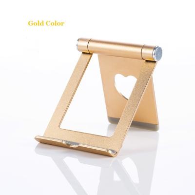 China Multifunctional Mobile Phone Tablet Stand Mobile Phone Tablet Holder Metal Phones/Tablets Stand Unique Creative New Products for sale