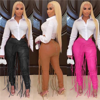 China Anti-wrinkle fashion ladies pants PU bandage leather tassels skinny plus size winter women long trousers for sale