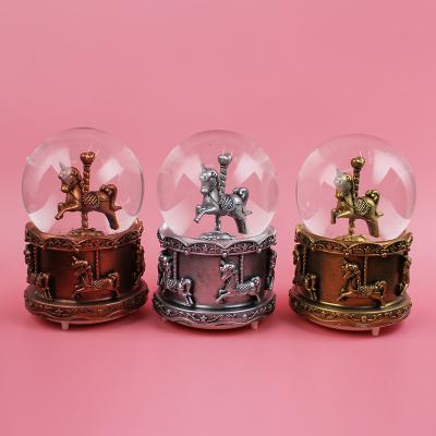 China High Quality China 100mm Cartoon Resin Music Snow Globe Christmas Snow Globe with Music and Lights for sale