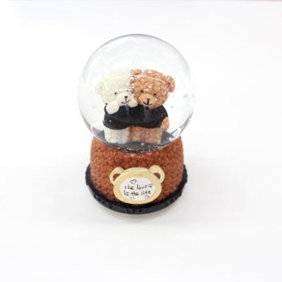 China Custom Music Snow Globe 80mm Water Snow Globe Custom Europe Snow Globe for sale