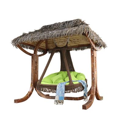 China 2021 Outdoor Furniture Modern Solid Wood Swings Cover Hanging Roof Straw Rope Seat Patio Wood Exaggerated Thatch Swing for sale