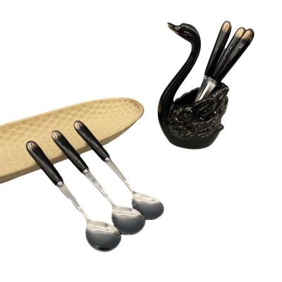 China Sustainable Flatware Sets 2022 Wholesale Modern Black Stainless Steel Spoons Ceramic Spoon Handle With Swan Box for sale