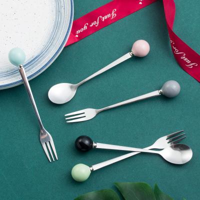 China Viable Porcelain Handle Color Japanese and Korean Macaron Fork Ceramic Stainless Steel Fruit Stirring Spoon for sale