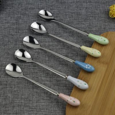 China Durable Ceramic Color Porcelain Handle Water Drop Stainless Steel Spoon for sale