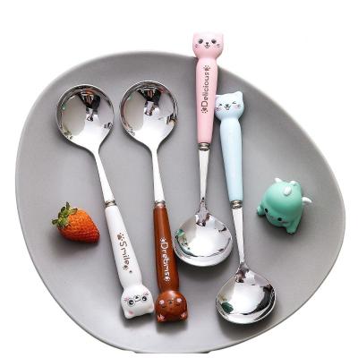 China Stocked Personalized Cute 304 Stainless Steel Ceramic Cartoon Handle Household Dessert Kids Fork Spoon for sale