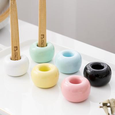 China Basic Simple Viable Ceramic Nordic Frame Personality Family Toothbrush Holder Ceramic Holder for sale