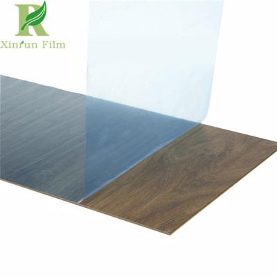 China 0.03-0.2mm Clear Blue Guard Against Damages Wood Self Adhesive Film for Effective Protection for sale