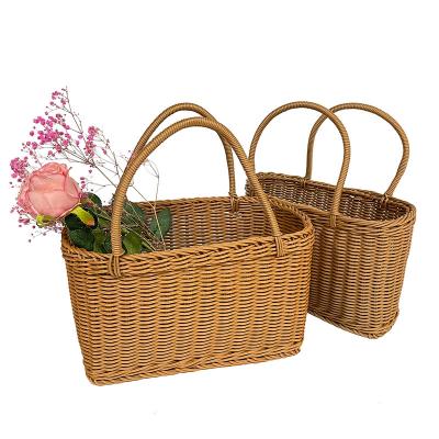 China Sustainable Hot Selling Portable Handle And Lid Wicker Basket Rattan Basket Handmade Woven Picnic Storage Basket for sale