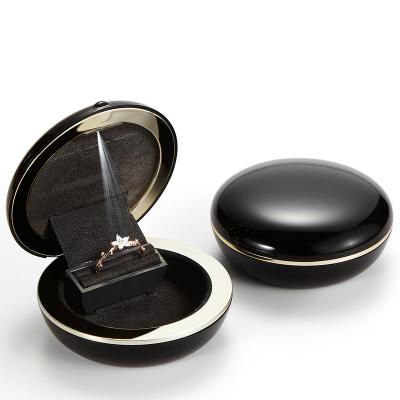 China Cheap Round Velvet Factory Pie Shape Baking Vanish Pink Black Gold Maiden White Red Gray Engagement Luxury Ring Storage Led Box for sale