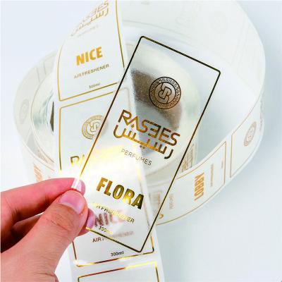 China Logo Printing Roll Transparent Clear Waterproof High Quality Custom Gold Foil Self Adhesive Private Label Sticker for sale