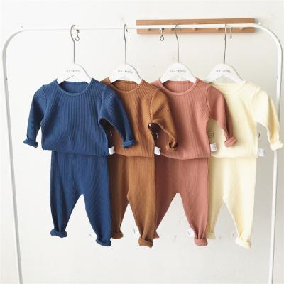 China Hot Selling Anti-wrinkle Newborn Baby Clothes Solid Color Baby 2pcs Ribbed Pajamas Rib Cotton Clothing Set for sale