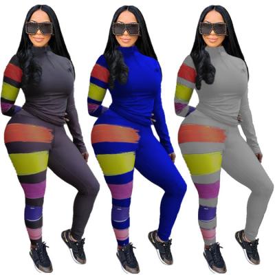 China Wholesale Viable Winter Zipper Neck Patchwork Stripped Lady 2021 Set Two Piece Women Clothing Top And Pants Two Piece Tracksuits for sale