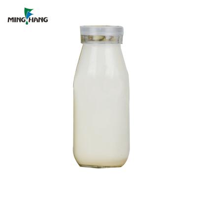 China 200ml Beverage Milk Bottle Clear Glass Beverage Bottle With Cover for sale