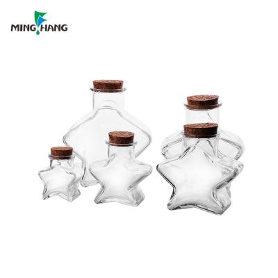 China Household products clear star shape 3ml 6ml 7ml 7ml 9ml soy candy glass jar with cork for sale for sale