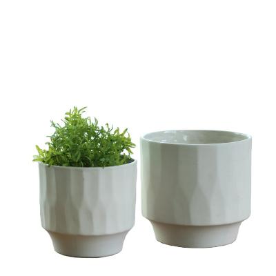 China Simply New Modern Design Round Shape Sandstone Planter Pots Home Decor Vase For Plants for sale