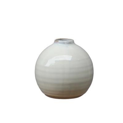 China Simply Natual Clay With White Reactive Glaze Round Shape Ceramic Flower Vase For Home Decor for sale