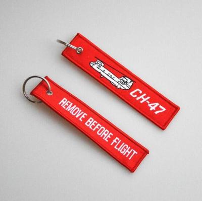 China Promotion Gift Custom Removed Before Fly Embroidery Key Chain Badge With Metal Ring Flight Keychain for sale