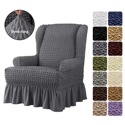 China Fit Perfect 100% Polyester Seersucker Bubble Cotton Fabric High Elasticity Slip Covers Elastic Skirt Wingback Chair Sofa Slipcover for sale