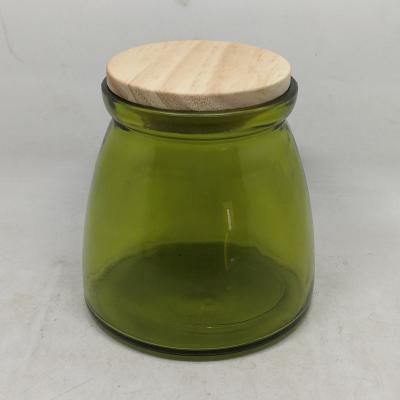 China Glass 23 oz empty glass candle jar with shiny amber lid shiny green for sale