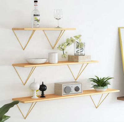 China Simple stocked modern word partition shelf wall living room TV wall shelf siding wrought iron decoration for sale