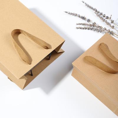 China Biodegradable Custom Brown Kraft Paper Shopping Kraft Bags With Handles for sale