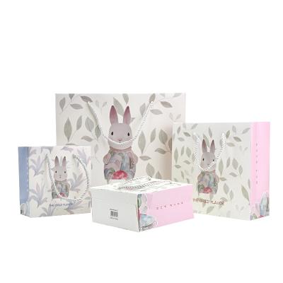 China Recyclable Custom Cute Rabbit Design White Paper Gift Shopping Bag With PP Rope Handles for sale