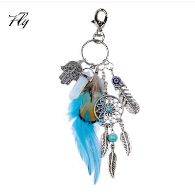 China Hot-selling Unisex Metal Egg White Stone Feather Gypsy Key Chain Key Chain for sale