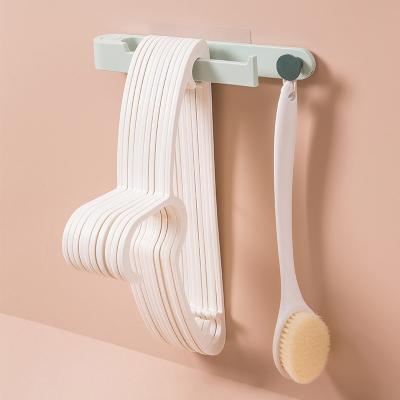 China Multifunctional Free Punching Modern Rotating Rack Hanger Balcony Storage And Finishing Clothespin The Rack Wall Hanging Hanger for sale