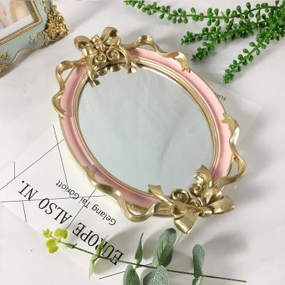 China Home Decoration Oval Pink Mirrored Decorative Tray With Bowknot Handle for sale