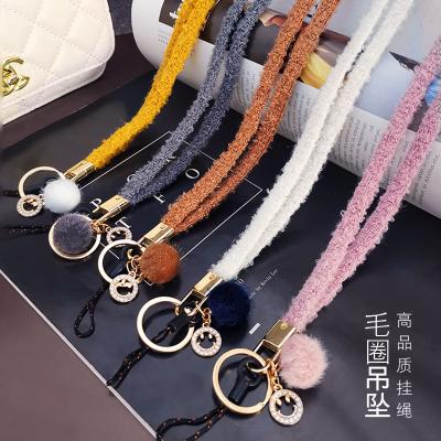 China Handwoven Chain Pom Pom Ball Removable Keychain of Popular Statistical Institute of Korea Phone Pendant Gift for Iphone 11 12 for sale