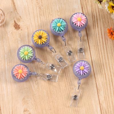 China China Sun Flower Style Manufacture Custom Retractable Plastic Heronsbill Badge Reel Holder for sale