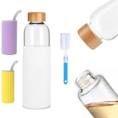 China Sustainable 2024 New Wholesale Silicone Sleeve Travel Borosilicate Glass Bottle With Bamboo Lid for sale