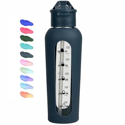 China Sustainable 700ml/ 1000ml Portable sports glass water bottle with handheld lid flip-top straw glass bottles with graduated silicone sleeve for sale