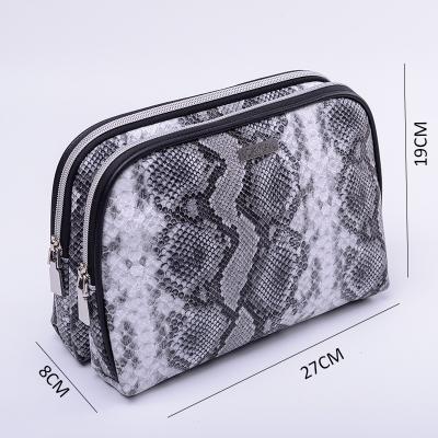 China Fashion Double Layer Bag Black White Printing PU Travel Toiletry Cosmetic Makeup Bag for sale