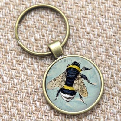 China Metal Bumble Bee Keychain on Light Blue BEE Print Key Ring Art Jewelry Glass Bee Keyring for sale