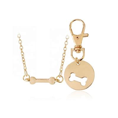 China Hot Sale Fashion Stainless Steel Dog Bone Best Friend Charm Necklace For Women With Key Chain for sale