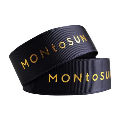 China OEM workable custom size 25 mm gold ribbon foil logo brand artwork black grosgrain ribbon 1 inch polyester printed ribbon for sale