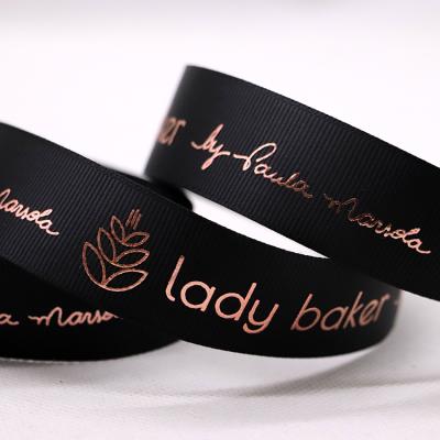 China Good Quality Custom Recyled 1 cm Black Double Face Grosgrain Riased Luxury 3D Ribbon Embossed Logo Printed Ribbon Rose Gold Foiling for sale