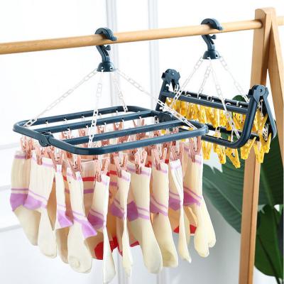 China MAIXI 32 Portable Multifunctional Adjustable Folding Plastic Hanger Modern Staples Hanger Baby Diaper Sock Cloth Holder Windproof for sale