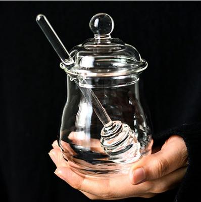 China Sustainable Unique Design Empty Clear Honey Jar With Glass Messy Person And Glass Lids for sale