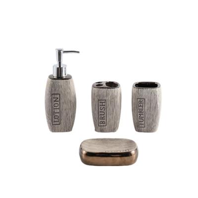 China Sustainable Simple Stripe Design Gray 4 Piece Hotel Accessory Ceramic Soap Dispenser Home Bathroom Set for sale