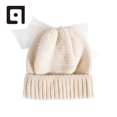 China COMMON Baby Beanie Top Knot Cap /Baby Beanie Cap /Baby Pink Bow Knitted Beanie Skull Cap for sale