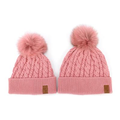 China Hot Selling Acrylic Knitted Pink COMMON Beanie Sets With Woven Label Pleat Brim Hat Cap Parent Child Kid Pom Pom for sale