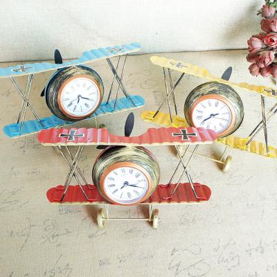 China Creative Home Eclectic Decoration Fashion Airplane Clock Metal Wrought Iron Airplane Clock Model Small for sale