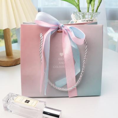 China Recyclable Luxury Ribbon Handle Boutique Shopping Packaging Customized Printed Tote Paper Gift Bags With Euro Logo for sale